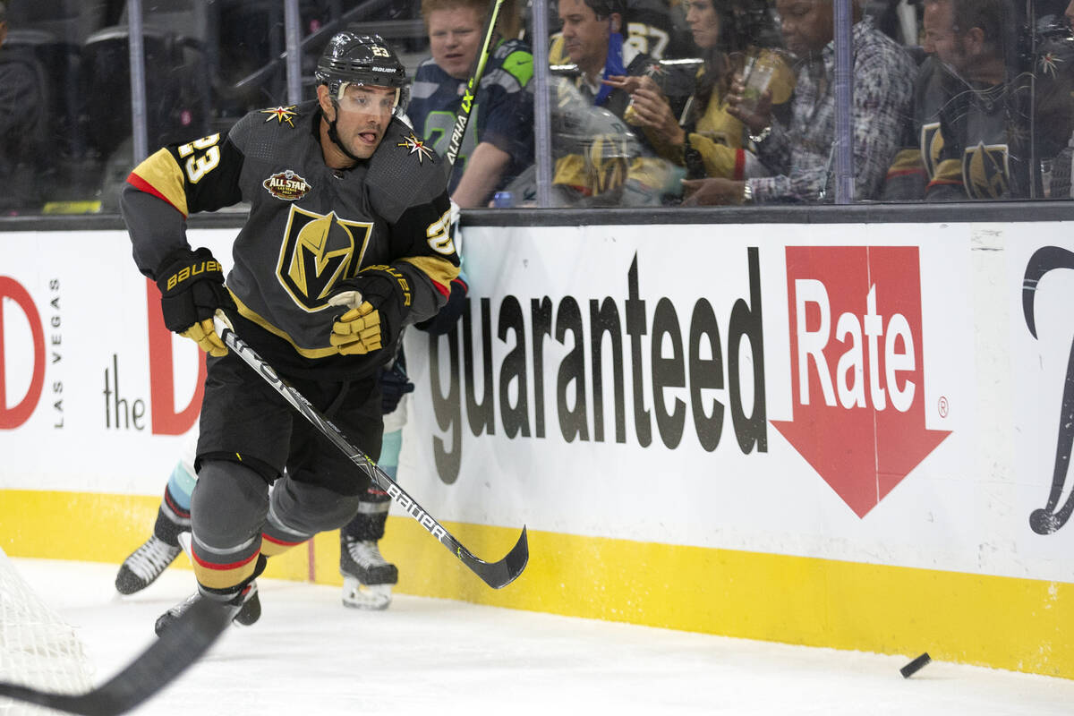 Golden Knights defenseman Alec Martinez (23) skates for the puck in the second period during an ...