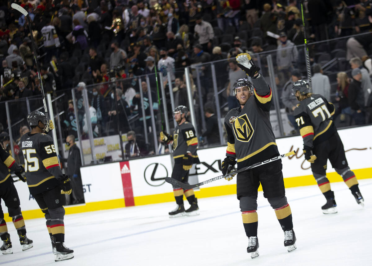 Golden Knights center Jonathan Marchessault (81) waves to someone in the crowd as his teammates ...