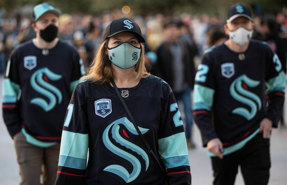 Seattle Kraken fans before the start of an NHL hockey game against the Golden Knights on Tuesda ...