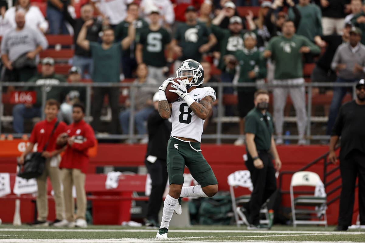 Michigan State wide receiver Jalen Nailor (8) on his way to score a touchdown against Rutgers d ...