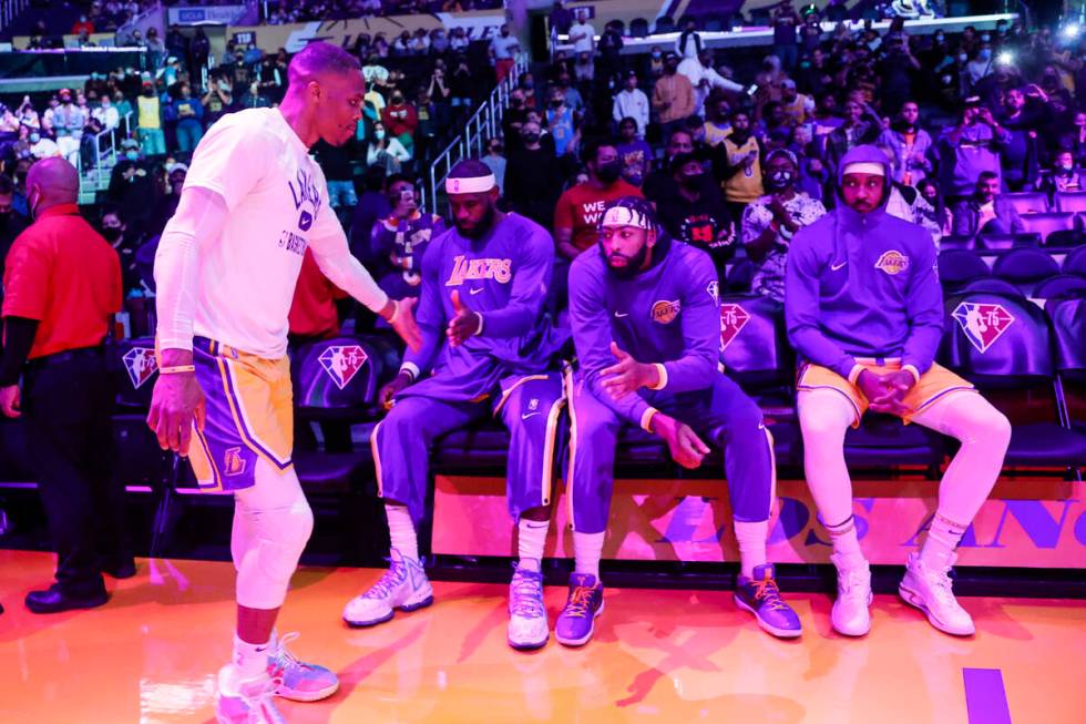 Los Angeles Lakers guard Russell Westbrook (0) greets forwards LeBron James (6), Anthony Davis ...