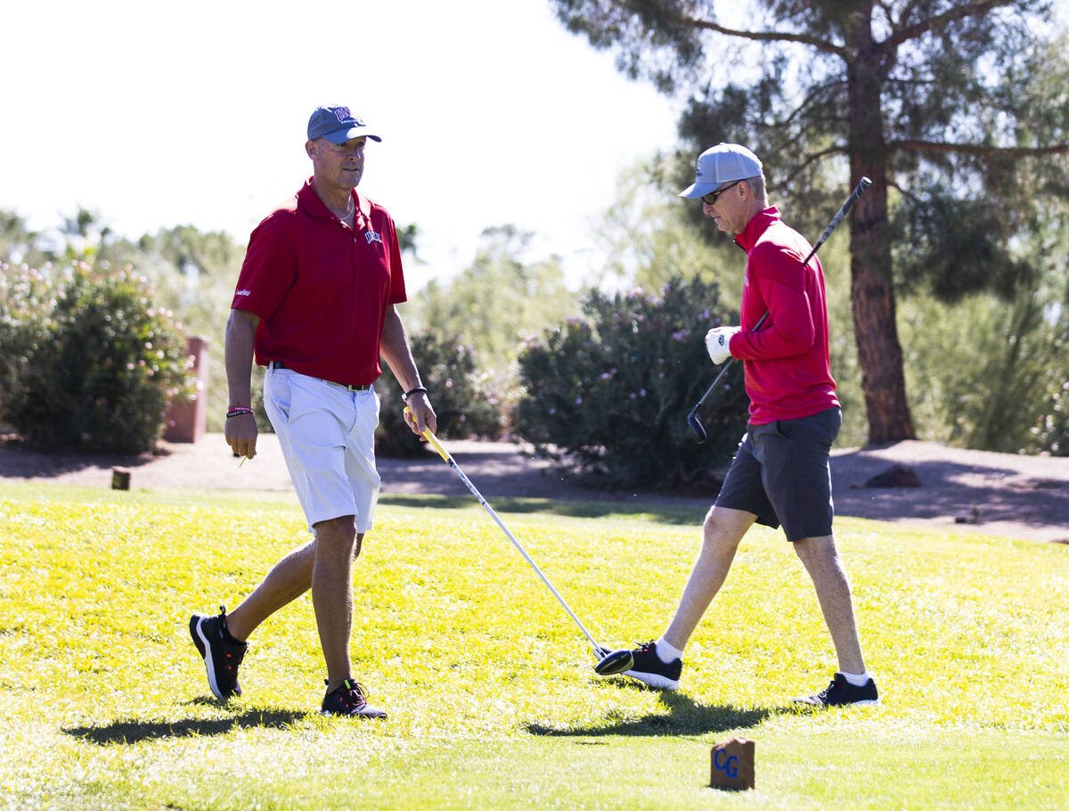 Former UNLV starting quarterbacks Derek Stott, left, and Steve Stallworth, play golf at Canyon ...