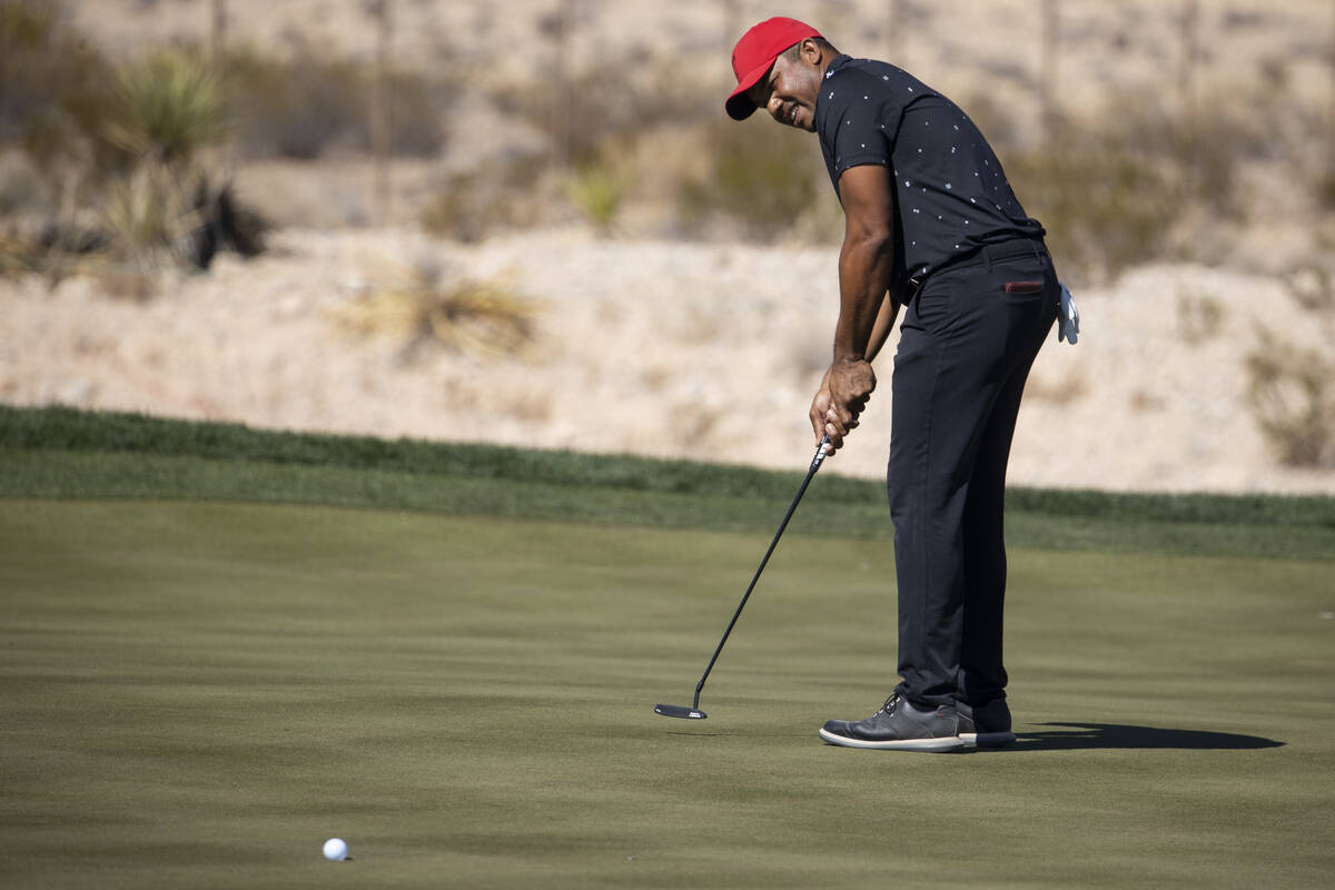 Jhonattan Vegas hits a putt for a birdie in the 18th green to complete the first round of the C ...