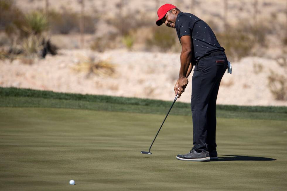 Jhonattan Vegas hits a putt for a birdie in the 18th green to complete the first round of the C ...