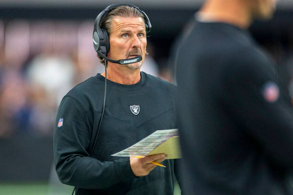 Raiders offensive coordinator Greg Olson coaches from the sideline during the first quarter of ...