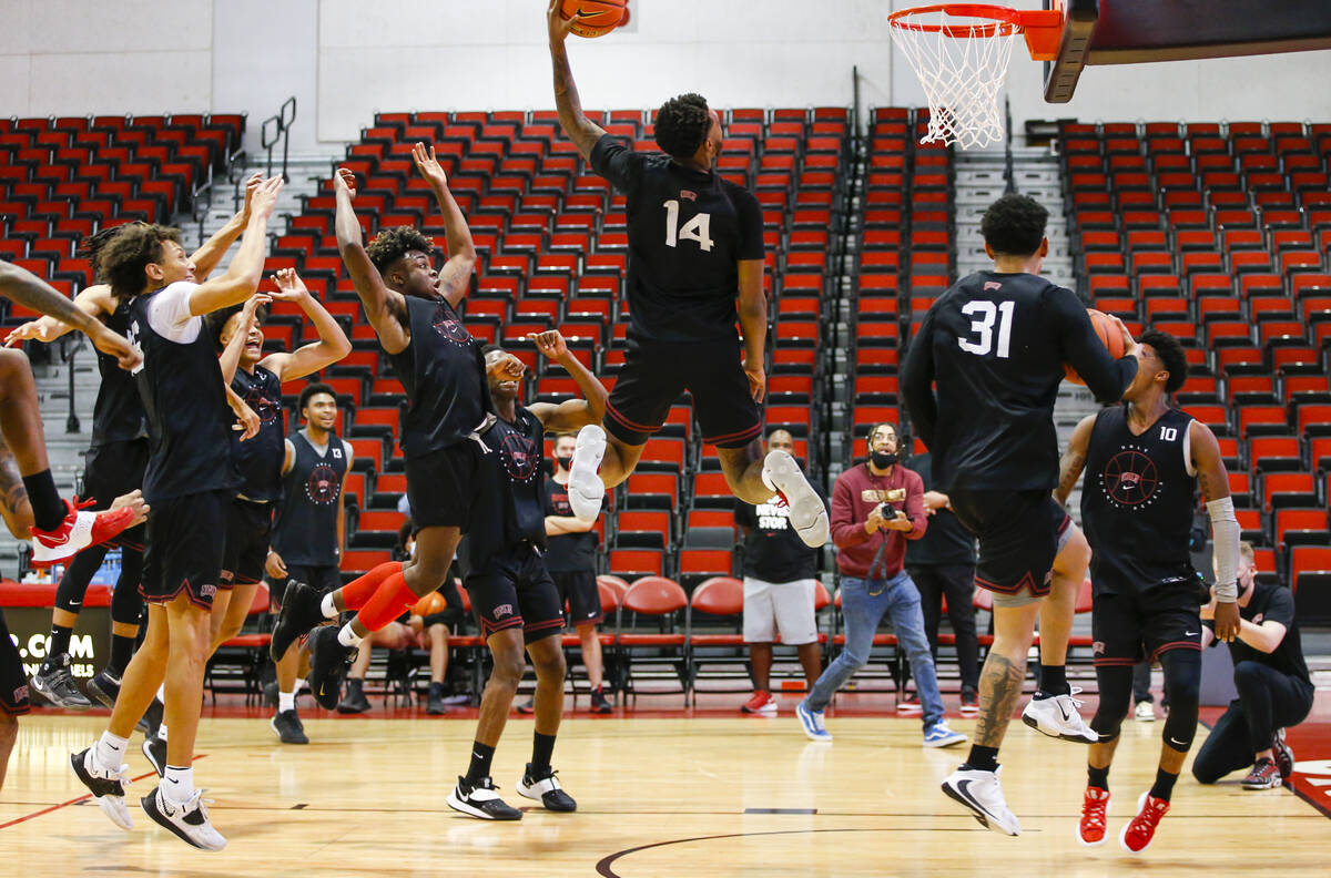 UNLVÕs Royce Hamm Jr. (14) goes to the basket during an open basketball practice and fundr ...
