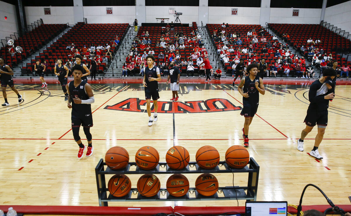 UNLV players warm up during an open basketball practice and fundraiser for former player Robert ...