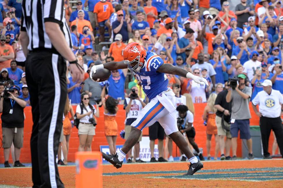 Florida running back Dameon Pierce (27) celebrates after rushing for a touchdown during the sec ...