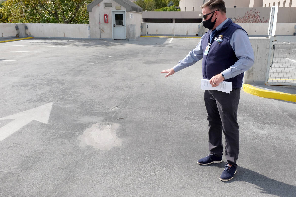 Facilities manager Jon Vietti points out a degraded section of the legislative building's parki ...