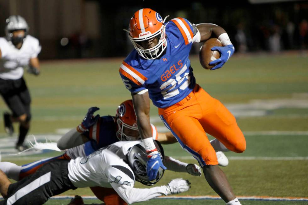 Bishop Gorman High School's William Stallings (25) runs into the end zone for a touchdown passi ...
