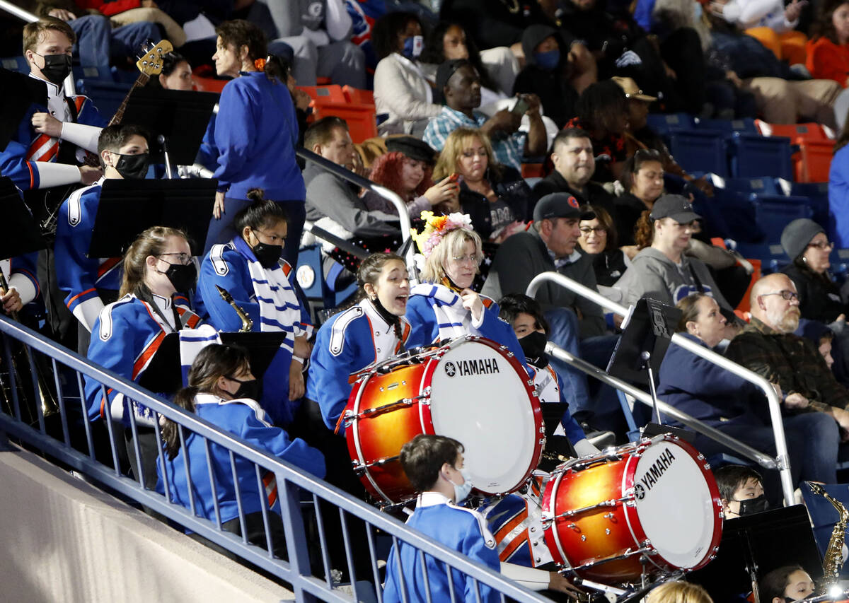Bishop Gorman High School's marching band cheer during the second half of a football game again ...