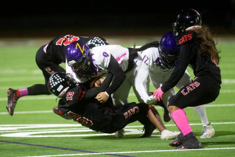Durango running back Cole Marquez (9) and wide receiver Micah Reyes (17) are brought down by La ...