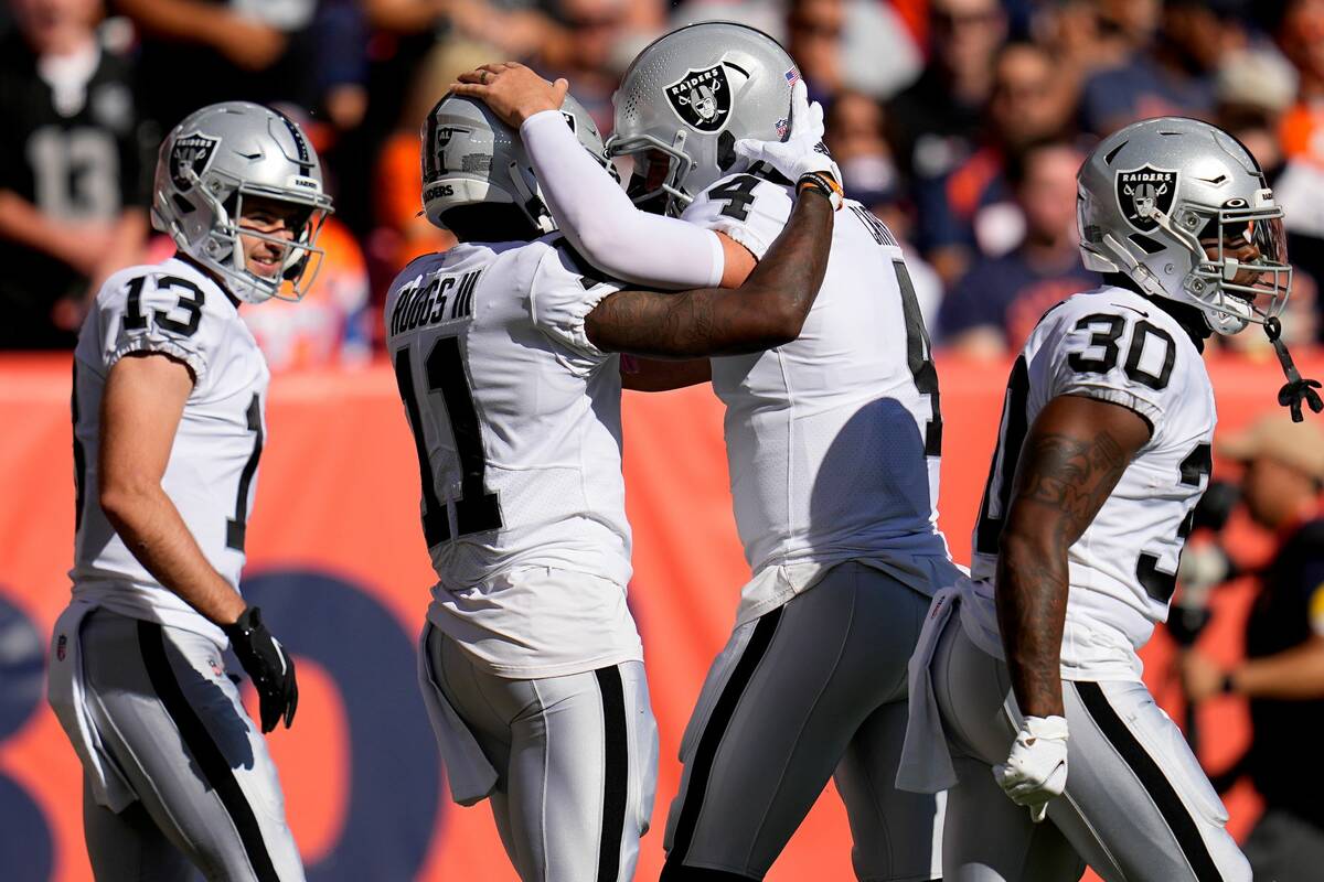 Las Vegas Raiders wide receiver Henry Ruggs III (11) celebrates his touchdown against the Denve ...