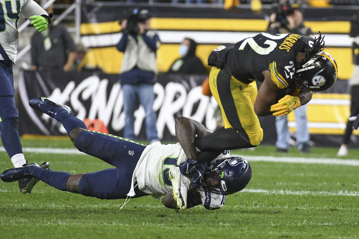 Pittsburgh Steelers running back Najee Harris (22) runs the ball as he is tackled by Seattle Se ...