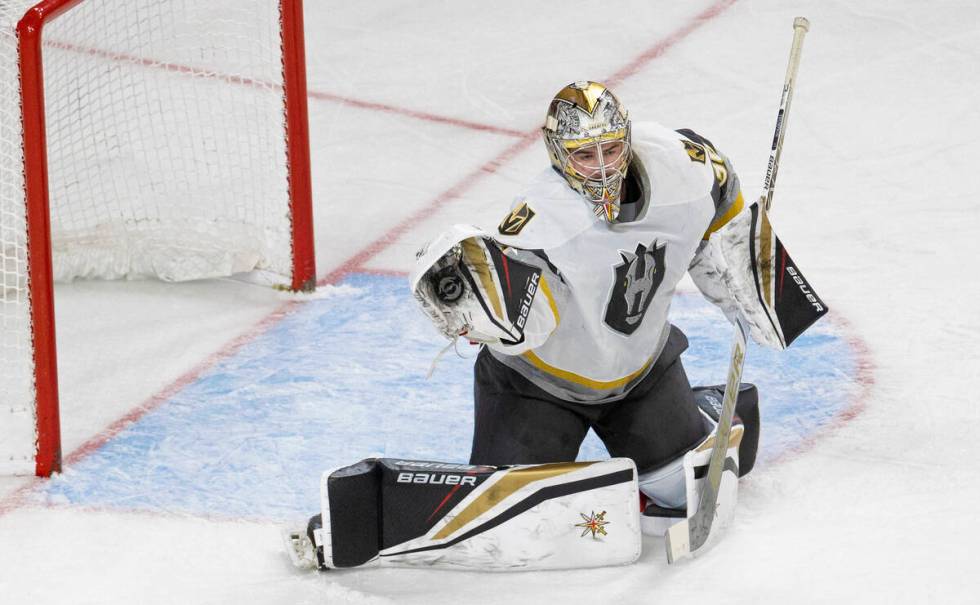 Silver Knights goaltender Logan Thompson (36) makes a save in the first period during an AHL ho ...
