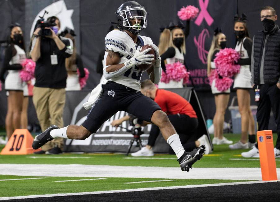 Utah State Aggies wide receiver Deven Thompkins (13) hauls in a touchdown catch in the first ha ...
