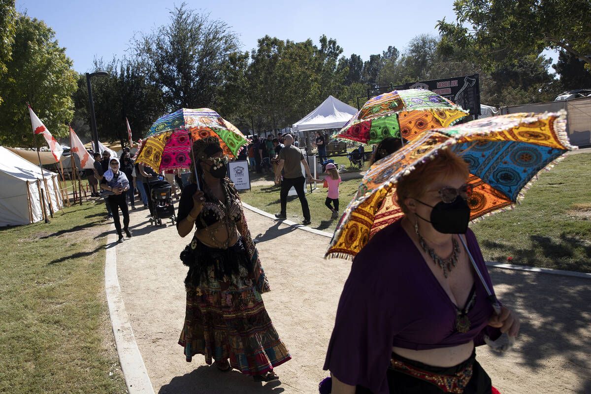 Costumed attendees make way through the grounds of Sunset Park during the Age of Chivalry Renai ...