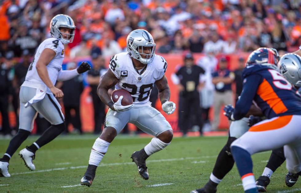 Raiders running back Josh Jacobs (28) looks for the end zone during the third quarter of an NFL ...