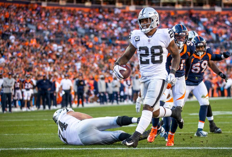 Raiders running back Josh Jacobs (28) eases into the end zone over the Denver Broncos during th ...