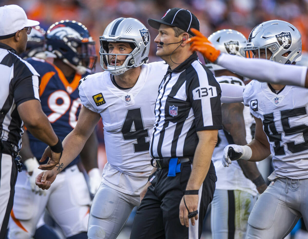 Raiders quarterback Derek Carr (4) is surprised by a penalty call versus the Denver Broncos dur ...