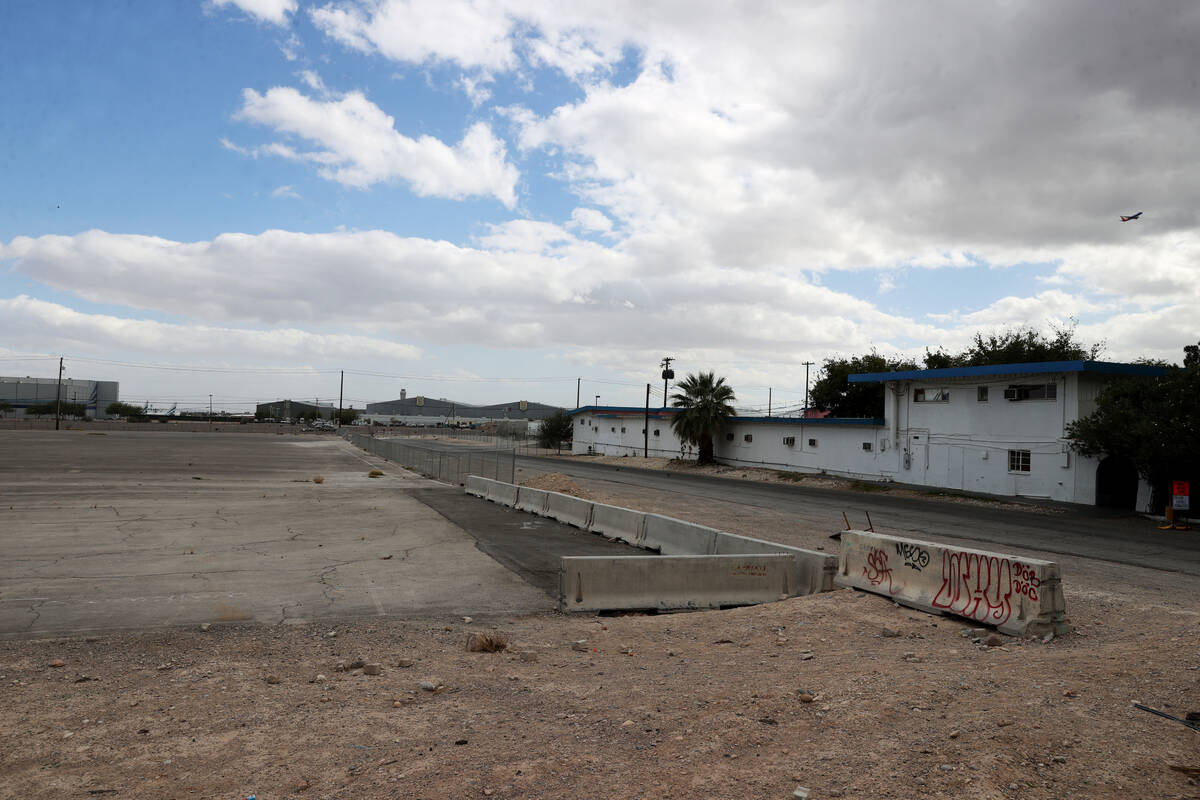 A plane takes off at McCarran International Airports near vacant land, left, at Las Vegas Boule ...