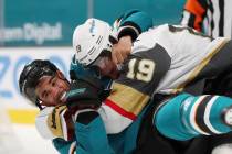 San Jose Sharks left wing Evander Kane (9), bottom, fights with Vegas Golden Knights right wing ...