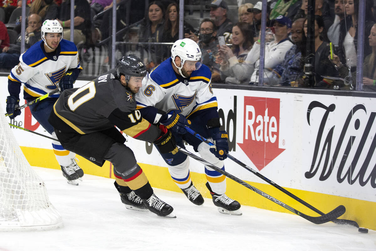 Golden Knights center Nicolas Roy (10) and Blues defenseman Marco Scandella (6) skate for the p ...