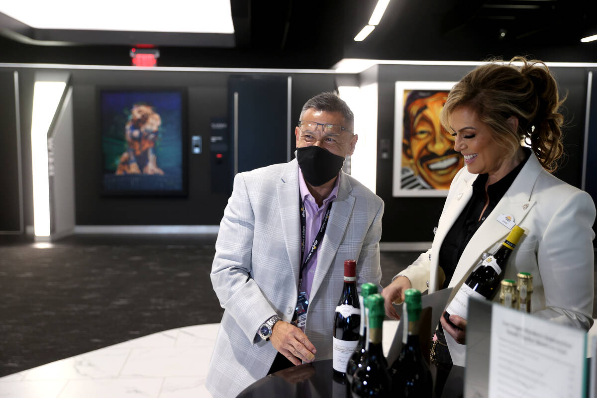 Sandra Taylor, head sommelier at Allegiant Stadium in Las Vegas, right, works with her assistan ...
