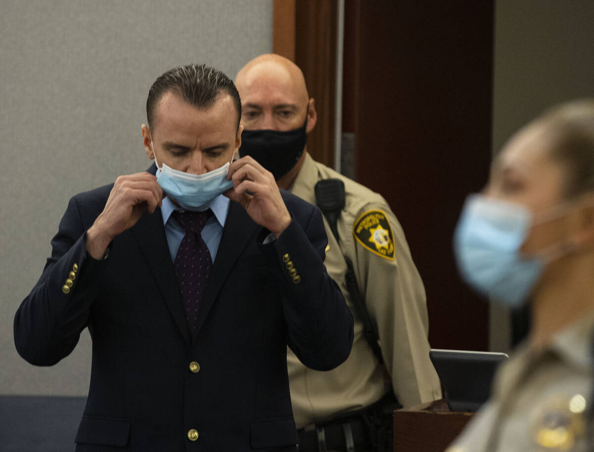 Michael Rusk led into the courtroom during his murder trial at the Regional Justice Center, on ...