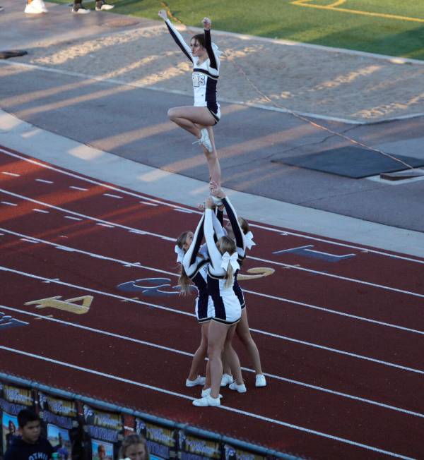 Foothill High School's cheerleaders performs before the first half of a football game at Foothi ...