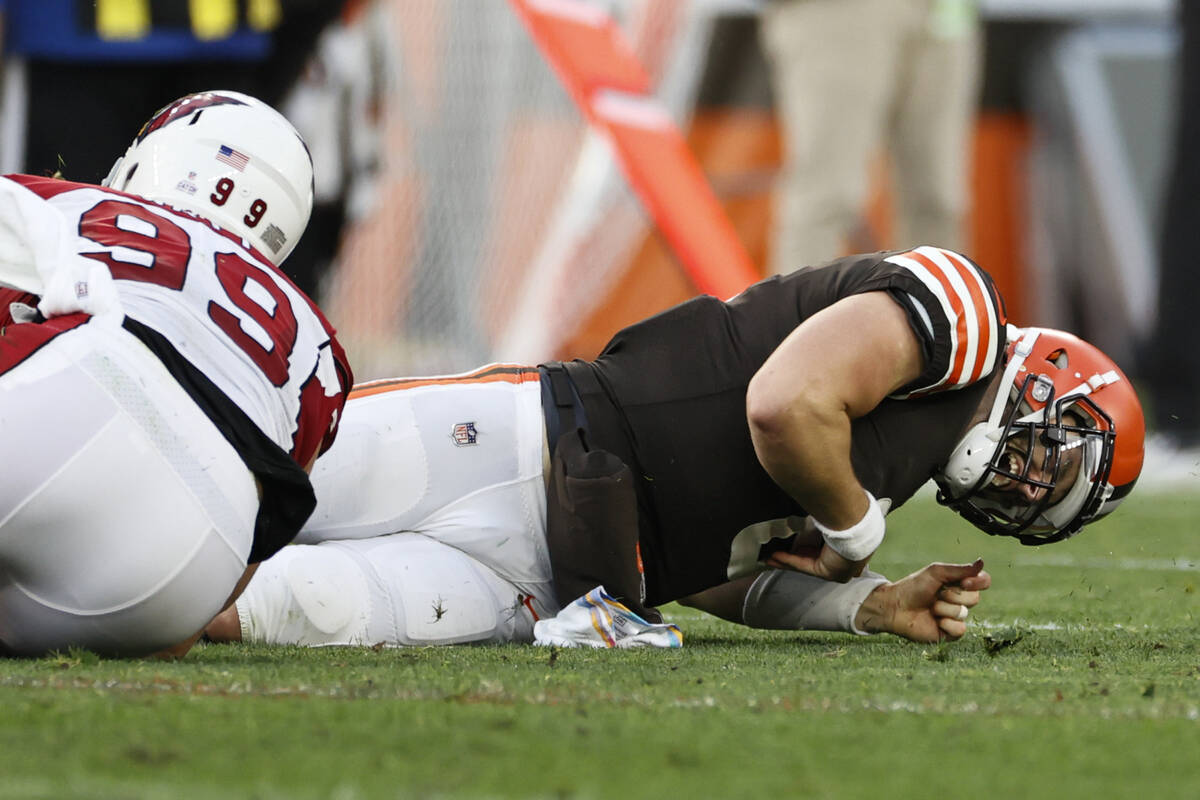 Cleveland Browns quarterback Baker Mayfield (6) gets injured on a hit by Arizona Cardinals defe ...