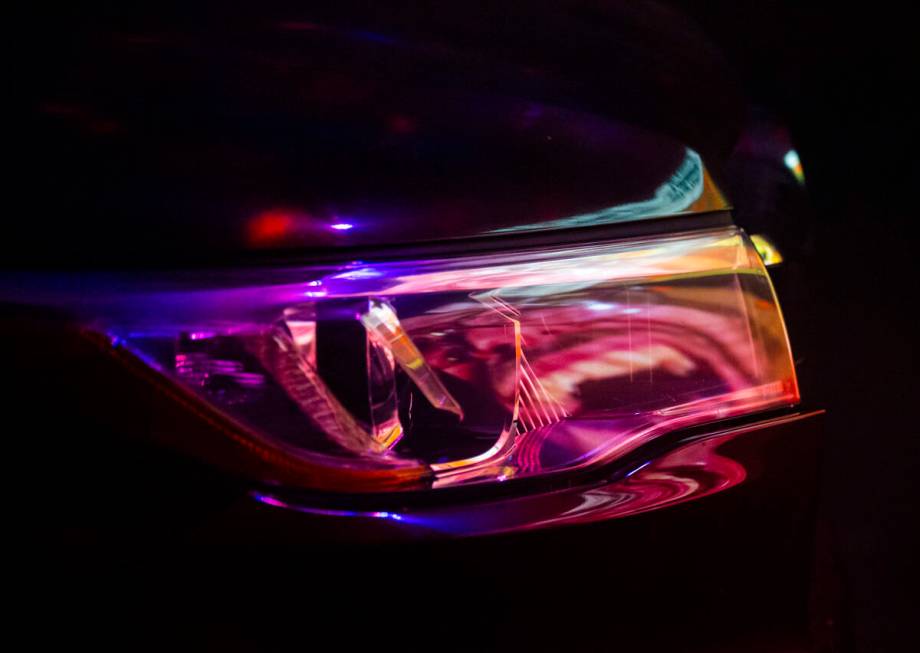A video is reflected in a car headlight at the start of the Horrorwood Video drive-in at the Ma ...
