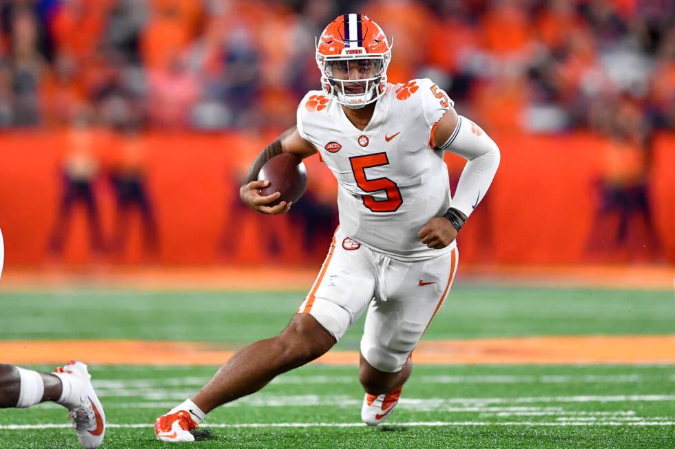 Clemson quarterback DJ Uiagalelei (5) runs with the ball during the second half of an NCAA coll ...