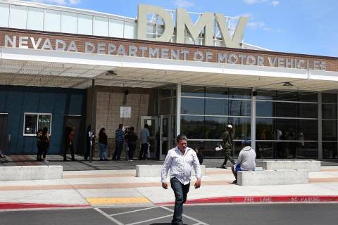 A customer walks past the DMV at Sahara office on Friday, May 10, 2019, in Las Vegas. (Bizuayeh ...