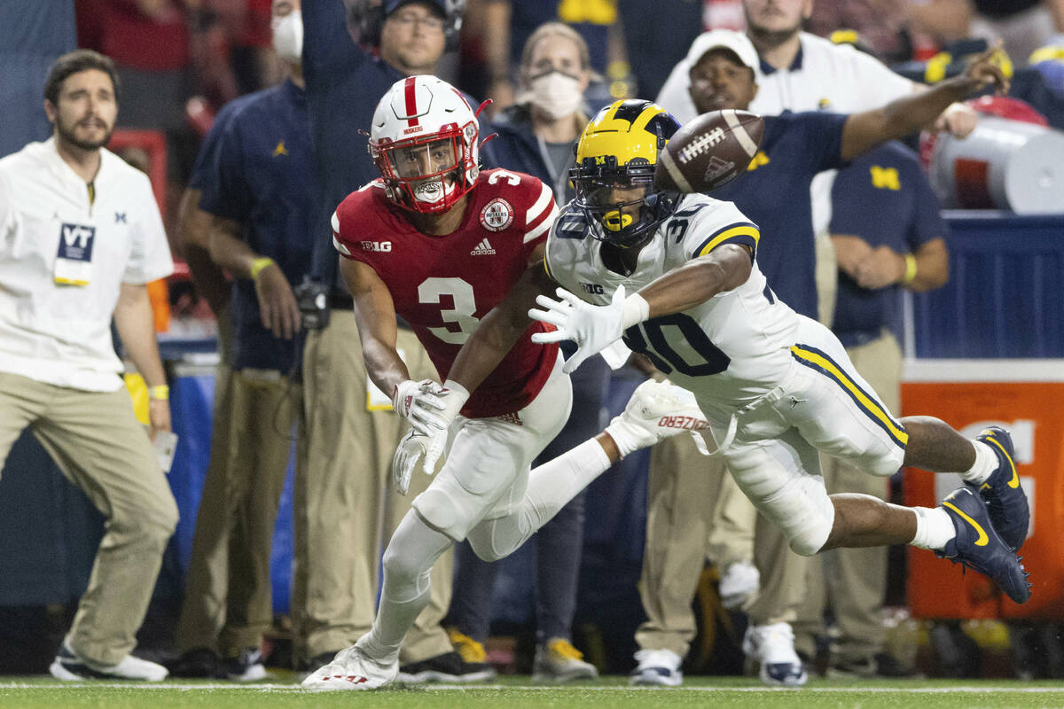 Michigan defensive back Daxton Hill (30) knocks away a pass intended for Nebraska wide receiver ...