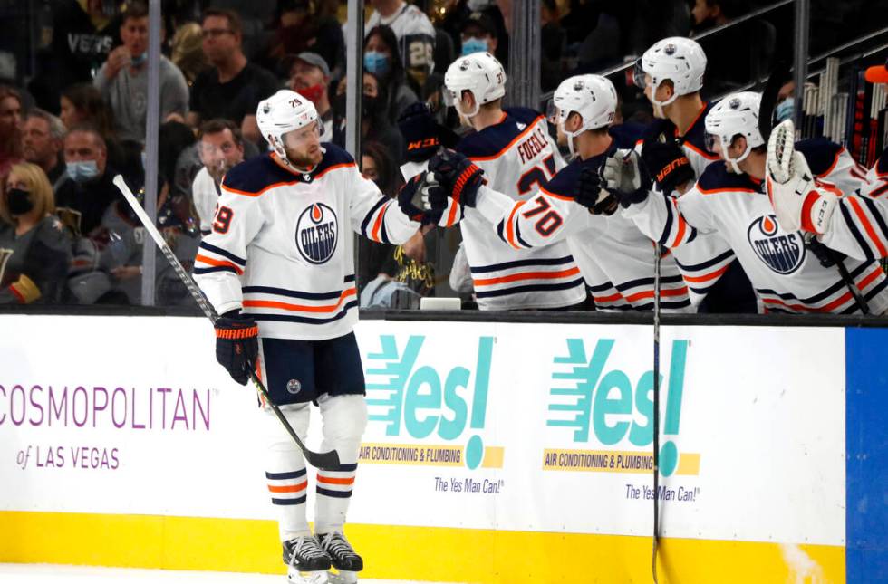 Edmonton Oilers center Leon Draisaitl (29) is congratulated by teammates after scoring during t ...