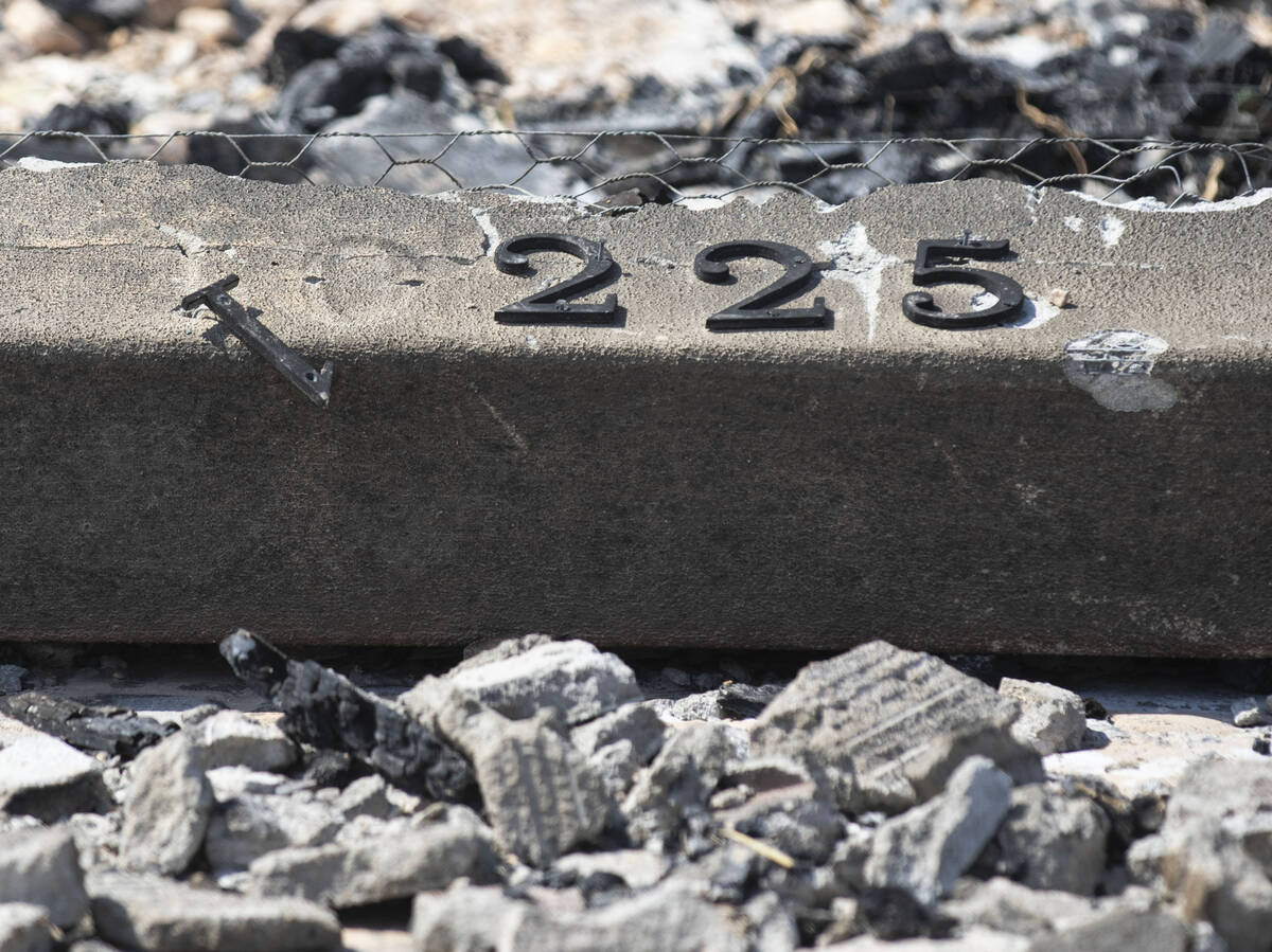 A house number is seen after being burned down in a controlled burn of houses on Schuster Stree ...