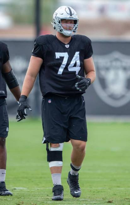 Raiders offensive tackle Kolton Miller (74) is seen wearing a knee brace during a practice sess ...