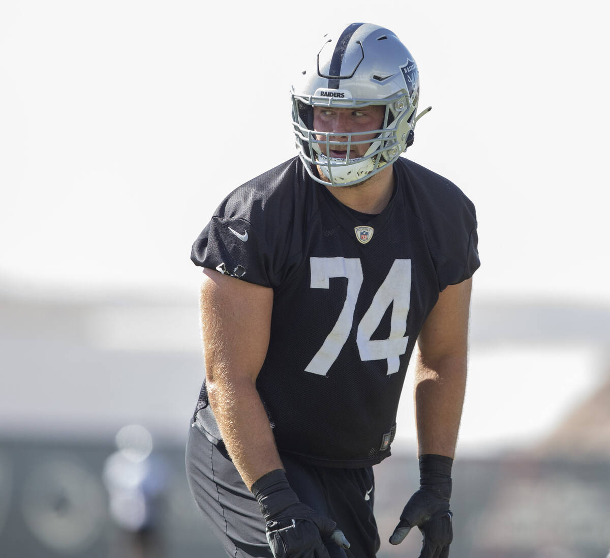 Raiders offensive tackle Kolton Miller (74) sets himself on the field during a practice session ...