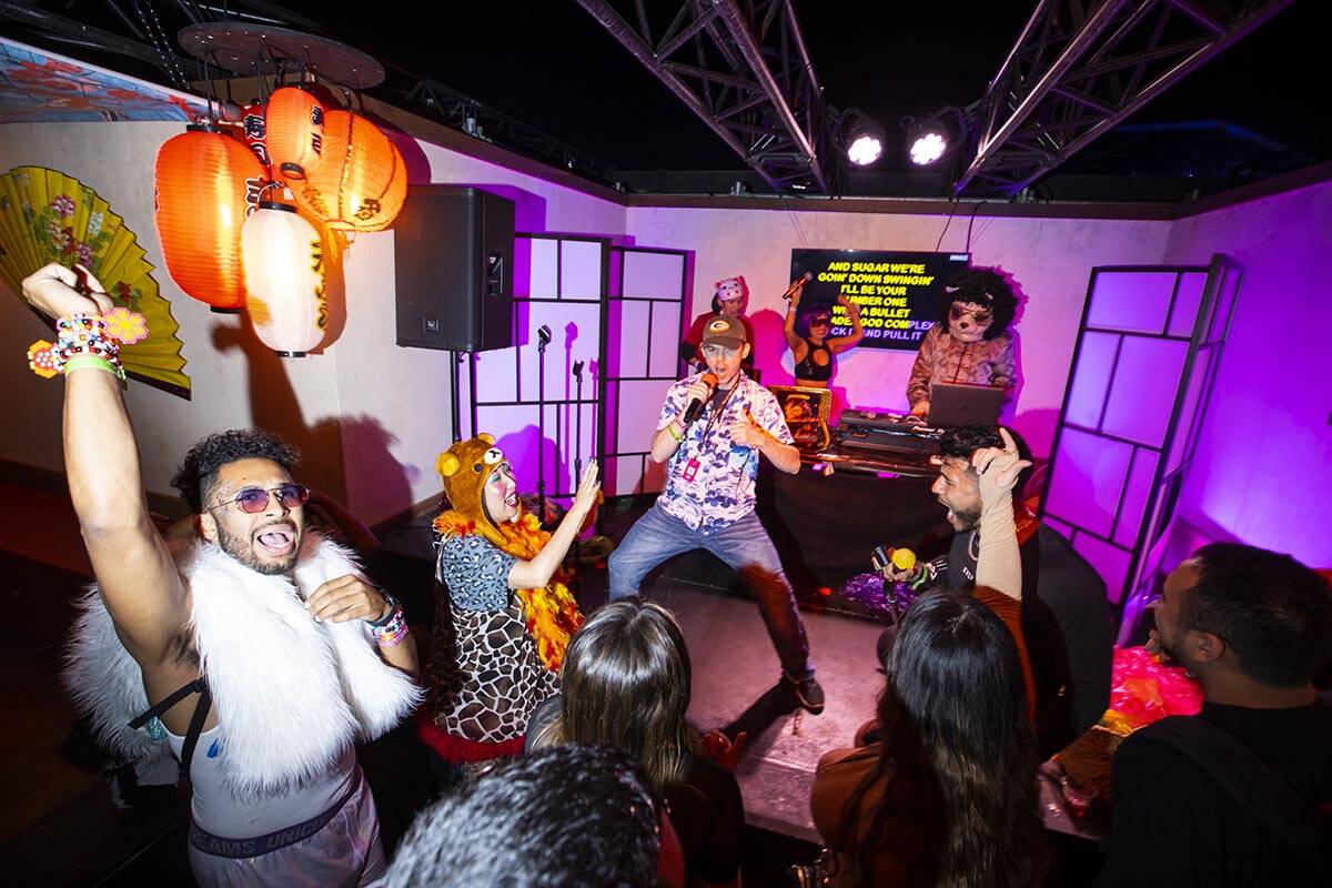People sing and dance at the Tokyo-style karaoke bar in the downtown EDC area during the final ...
