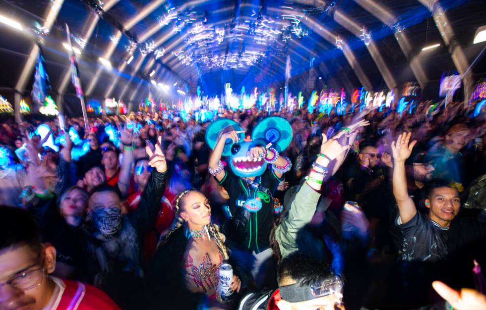 Attendees dance as Enrico Sangiuliano performs at the Neon Garden stage during the Electric Dai ...