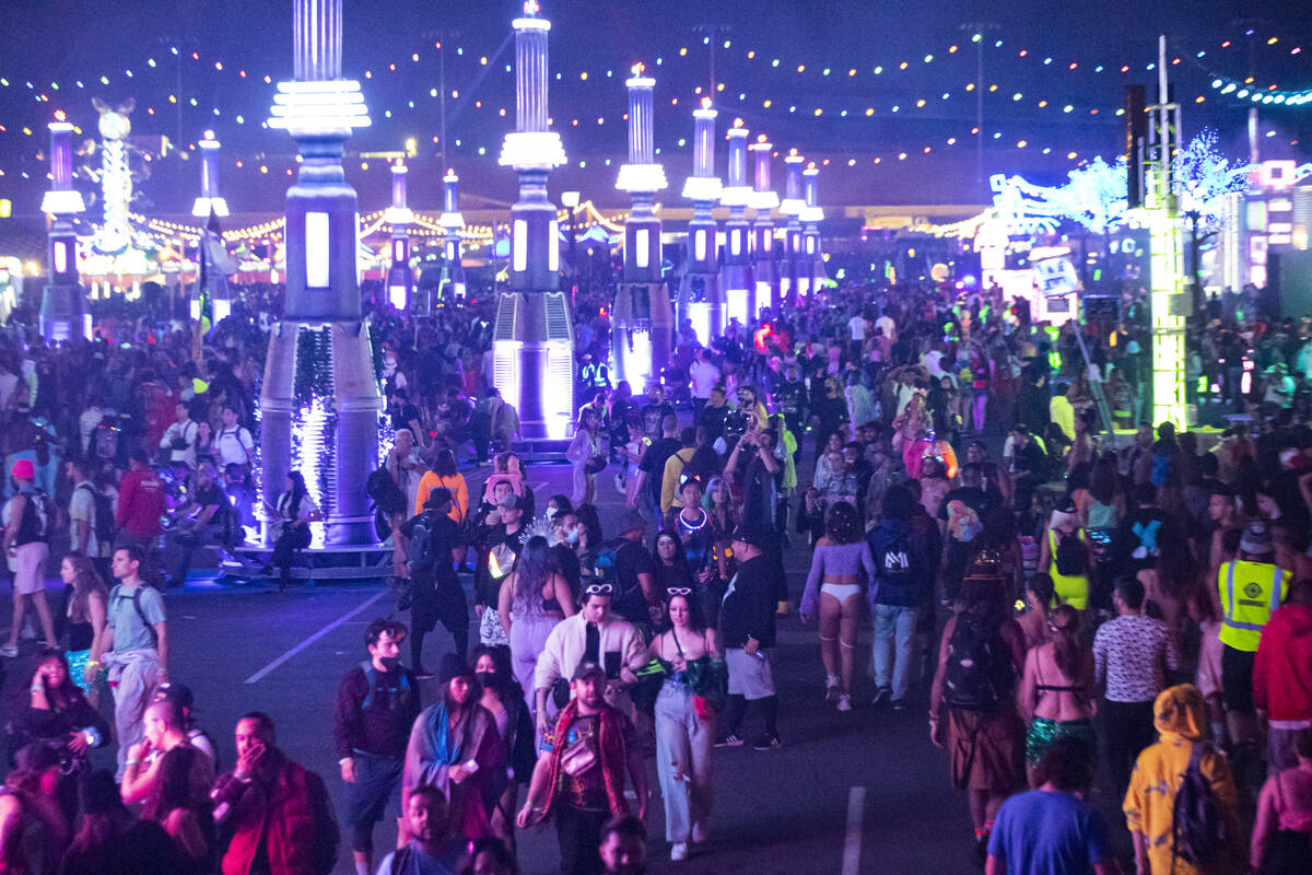 Attendees walk the festival grounds during the Electric Daisy Carnival at the Las Vegas Motor S ...