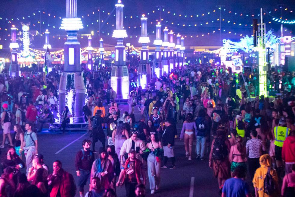 Attendees walk the festival grounds during the Electric Daisy Carnival at the Las Vegas Motor S ...