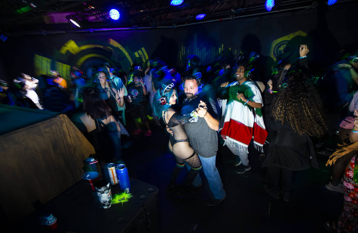 Attendees dance at a silent disco party during the Electric Daisy Carnival at the Las Vegas Mot ...