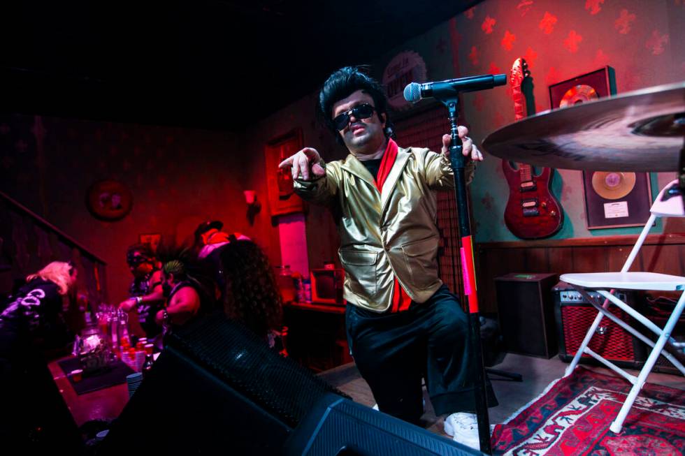 An Elvis tribute artist poses for a picture at the Mini Bar during the Electric Daisy Carnival ...