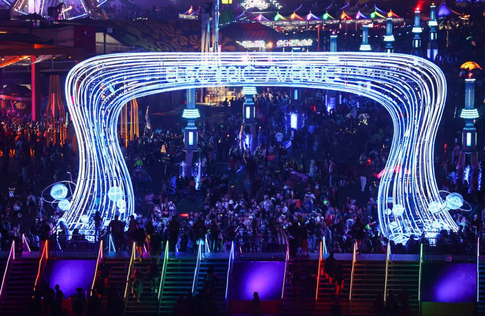 Attendees walk along Electric Avenue during the Electric Daisy Carnival at the Las Vegas Motor ...