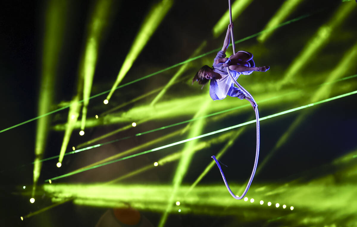 An aerialist performs in Nomads Land entertains the crowd during the second day of the Electric ...