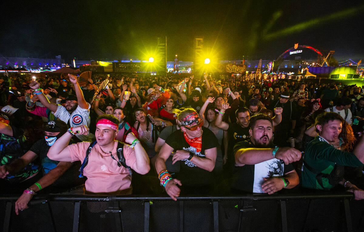 Attendees dance as Toneshifterz performs during the second day of the Electric Daisy Carnival a ...