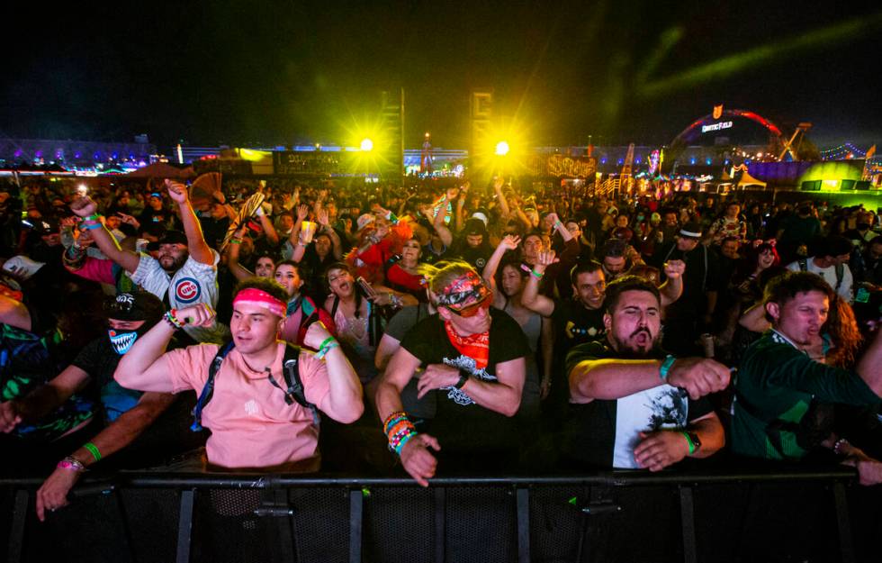 Attendees dance as Toneshifterz performs during the second day of the Electric Daisy Carnival a ...