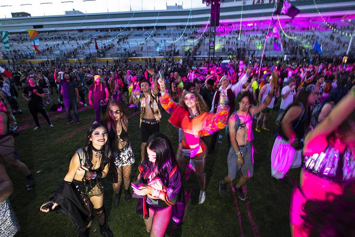 Attendees dance at the Cosmic Meadow stage during the first day of the Electric Daisy Carnival ...